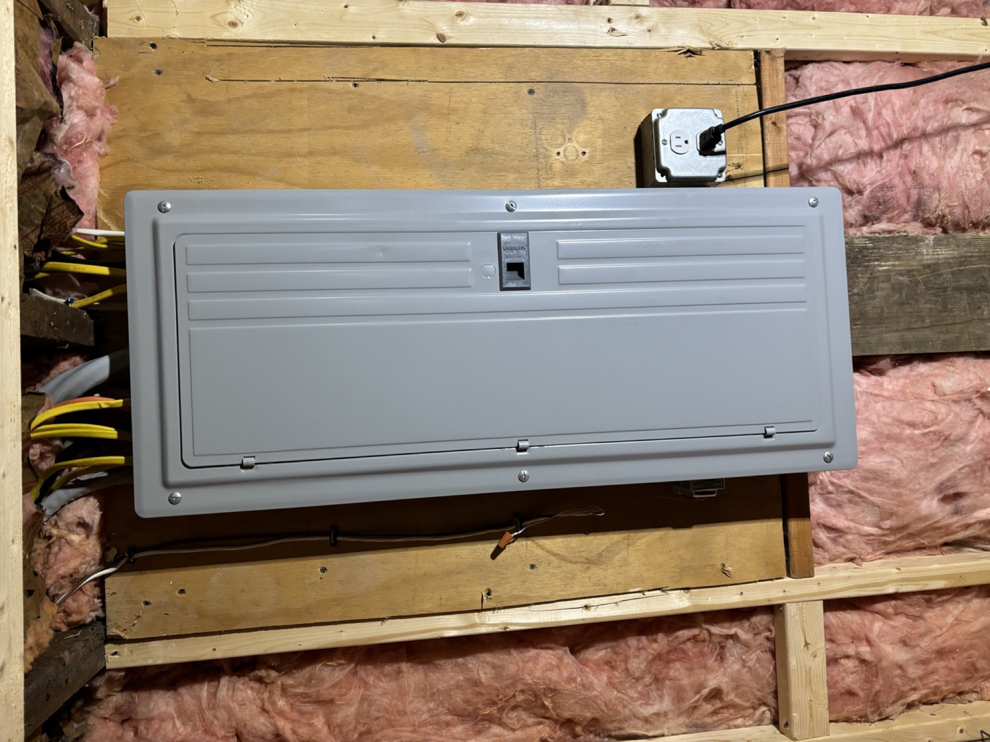 Newly installed electrical service panel with the cover closed