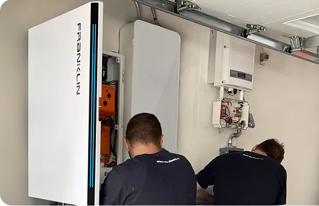 Nexis crew installing a FranklinWH battery with Enphase equipment